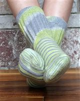 Green and gray socks on wooden floor