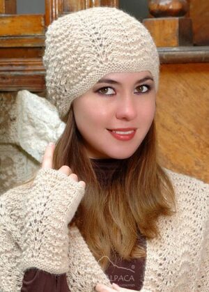 Woman wearing beige knitted hat and scarf