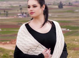 Serene woman with braided shawl
