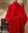 Red coat hanging on a rack