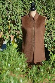 Mannequin with brown vest in garden setting