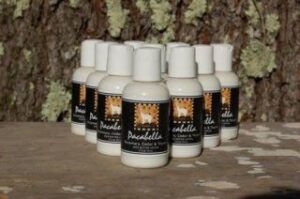 Skincare bottles arranged outdoors