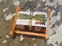 Wrapped soap bar on rustic surface