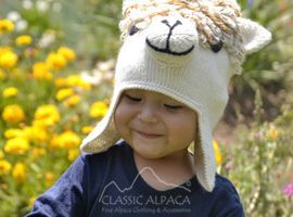 Cute baby in knitted alpaca cap