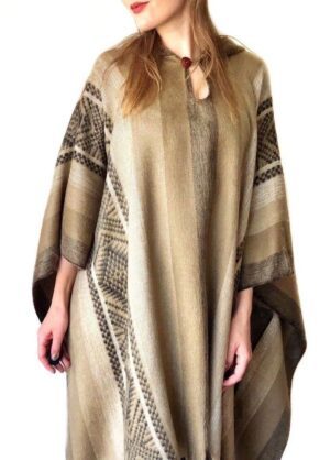 Woman in patterned beige poncho