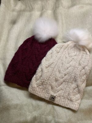 Cozy wool beanies with fluffy pom-poms