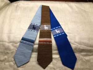 Three woven ties with llama patterns