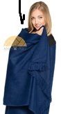 Blonde woman wearing a dark blue blanket