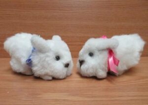 Fluffy toy bunnies with colorful ribbons