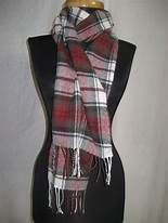 Mannequin wearing plaid scarf