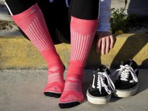 Pink socks and black sneakers outdoors