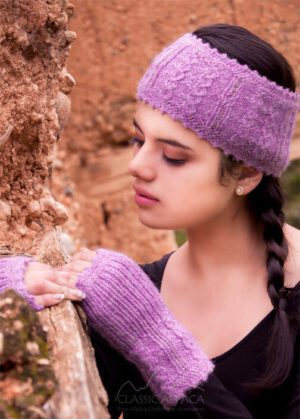 Young woman in purple knitwear with a contemplative expression.