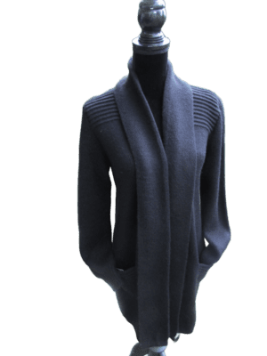 Elegant black cardigan with a shawl collar over a turtleneck.