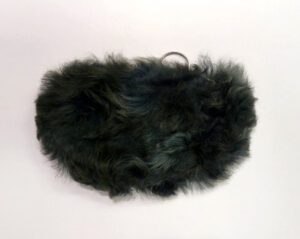Black fluffy fur muff for hands.