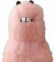 A fluffy pink plush toy with small eyes and a nose.