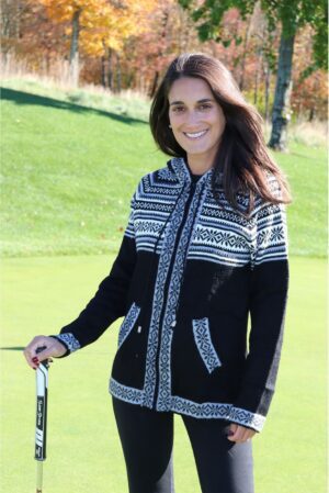 Smiling woman holding golf putter